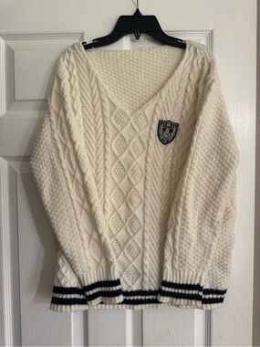 Cream Cable-Knit V-Neck Sweater with Crest Patch